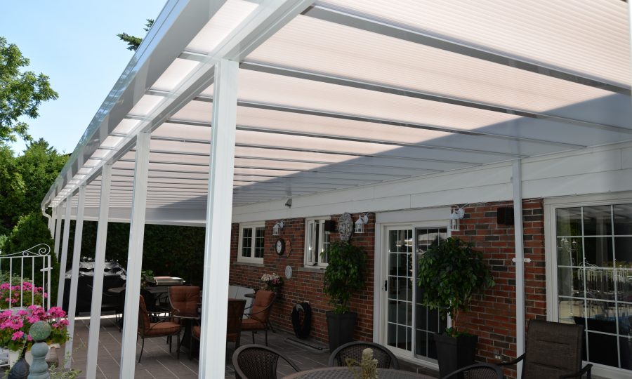 Translucent aluminum patio cover over a brick-home patio