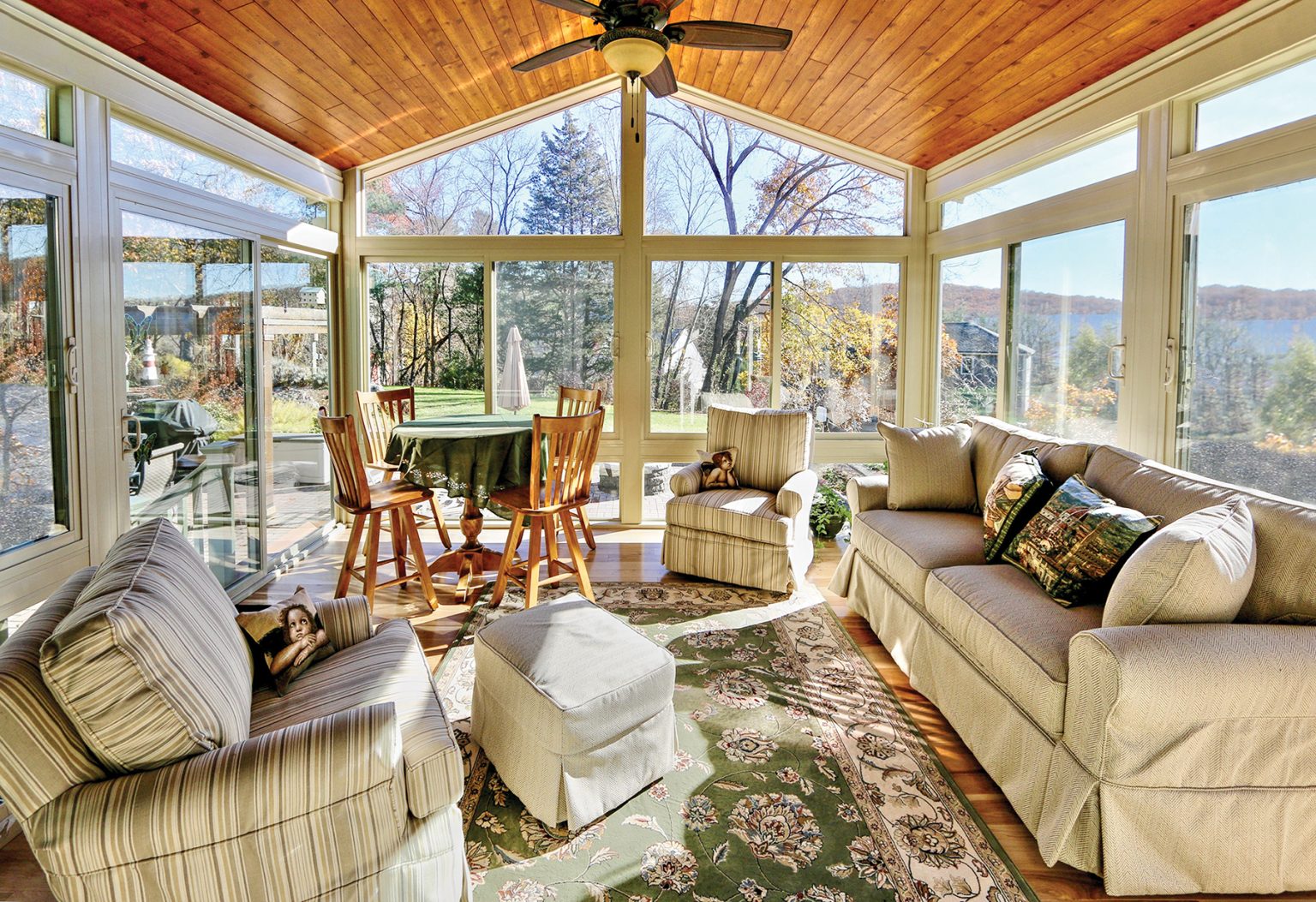 Interior of a Betterliving all-season sunroom with cathedral cedar ceiling